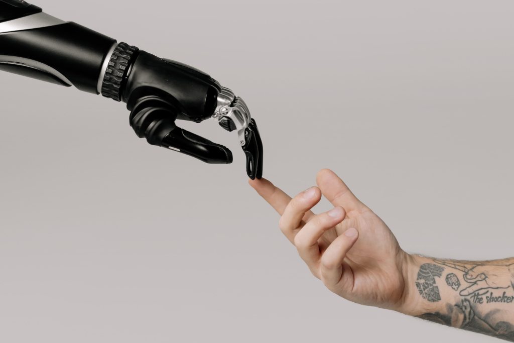 a robot hand touching a human hand
