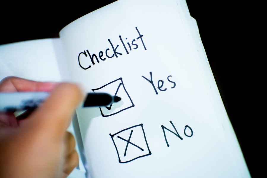 a notebook with a yes or no checklist
