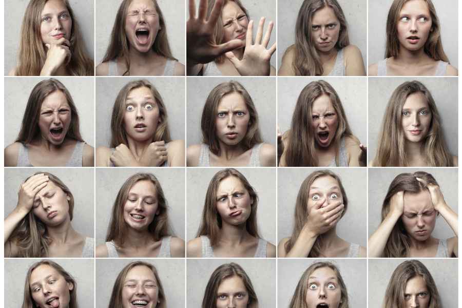 a grid of facial expressions by the same woman