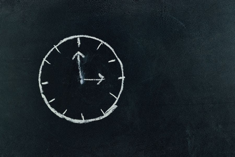 a clock drawn on the blackboard