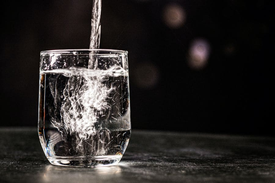 water pouring into a clear glass