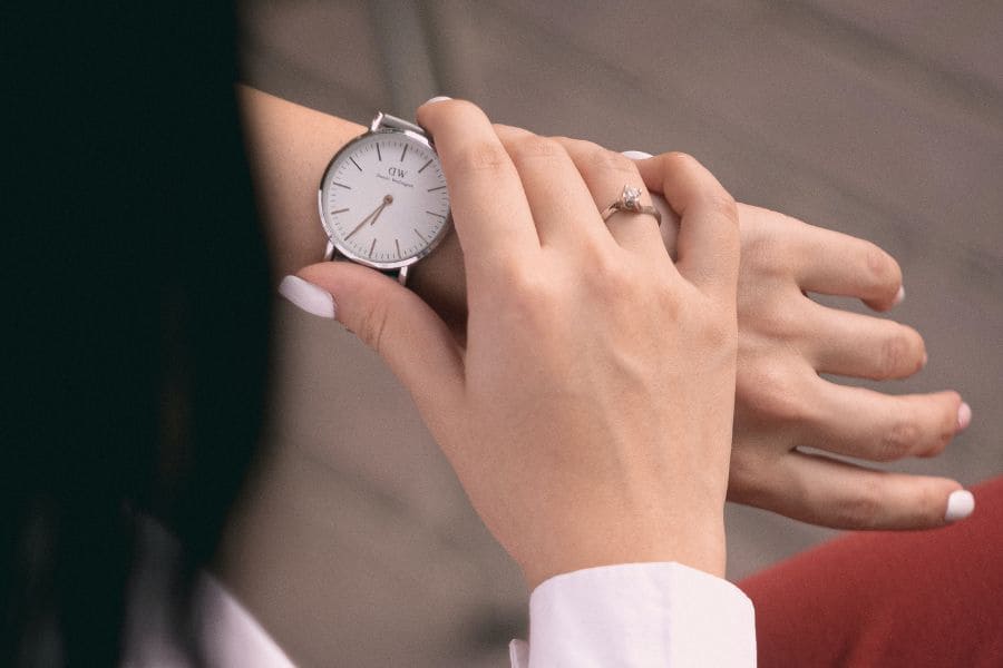 a woman checking her wristwatch