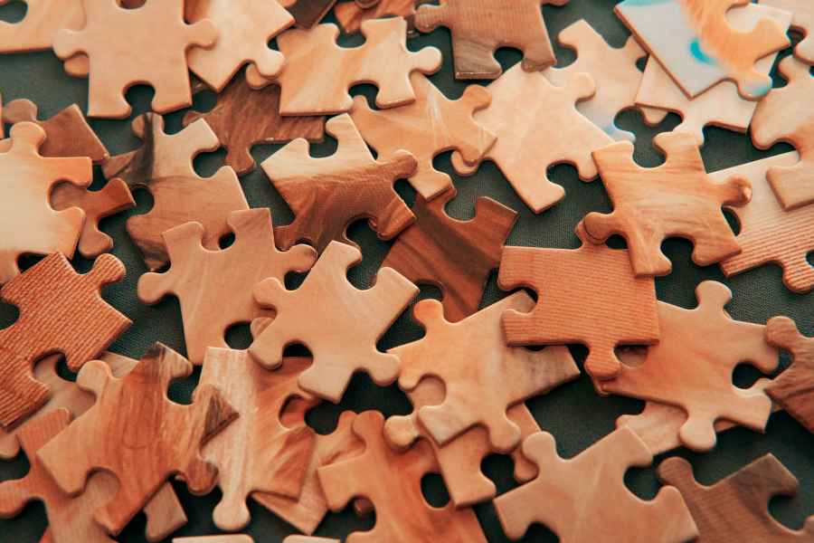 wooden puzzle pieces scattered