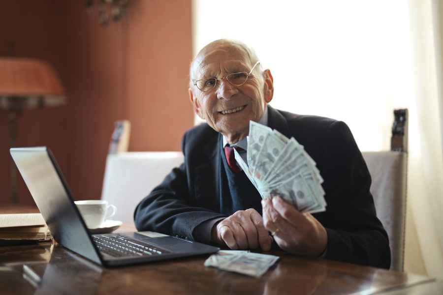 a businessman holding dollar bills