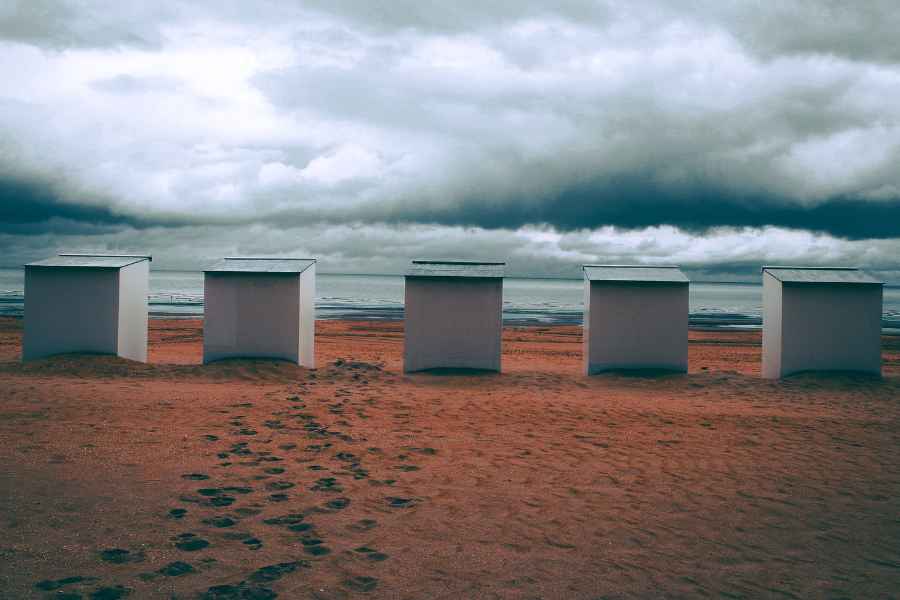five boxes on a beach