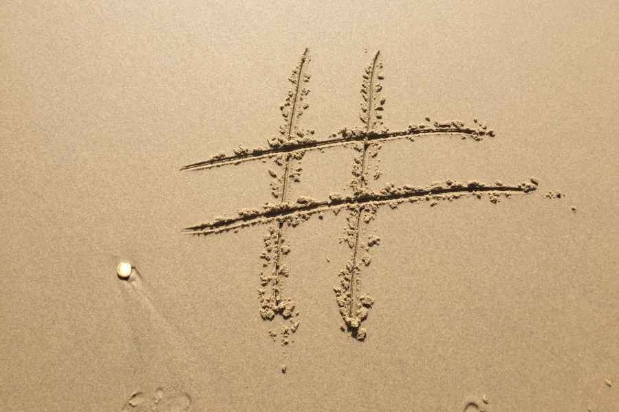hashtag drawn on sand