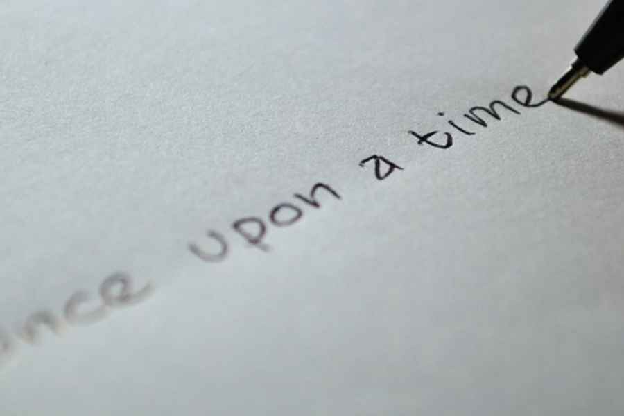 pen inscribing 'once upon a time"