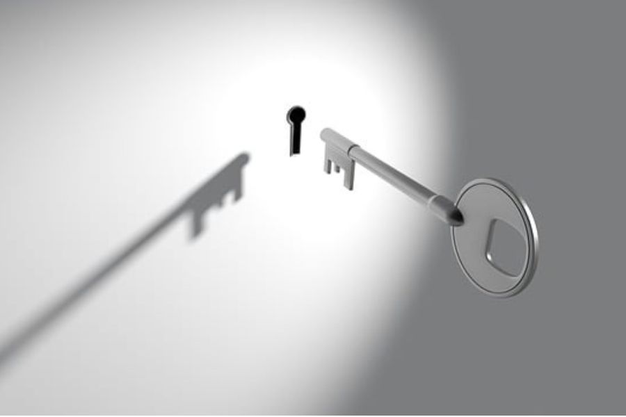 a key heading toward a keyhole