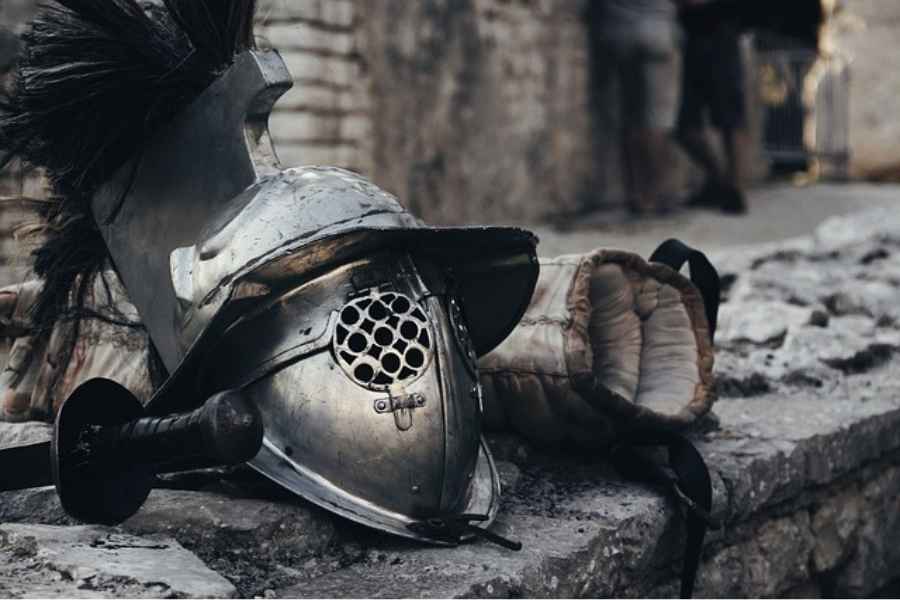 A knight's helmet on a stone ledge