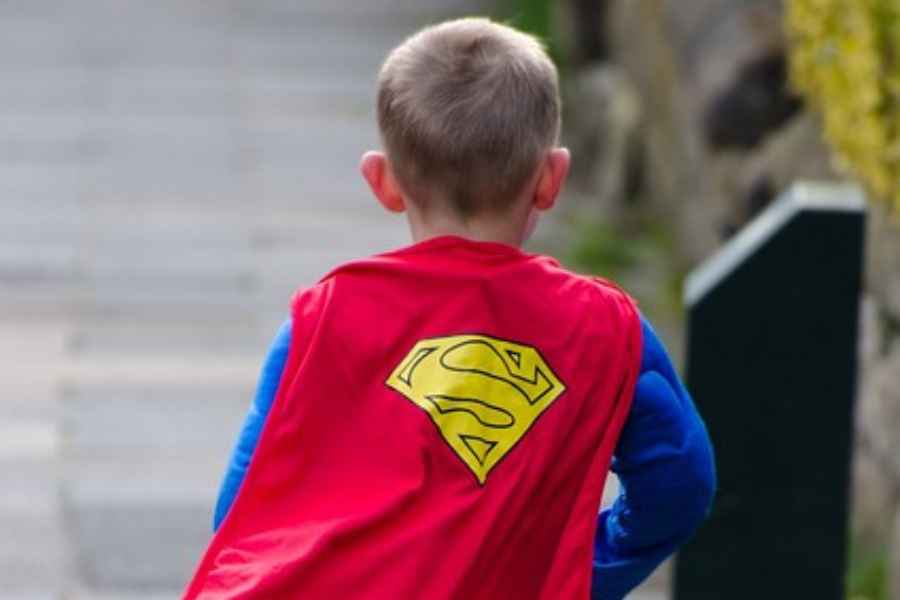 a boy in a superhero costume