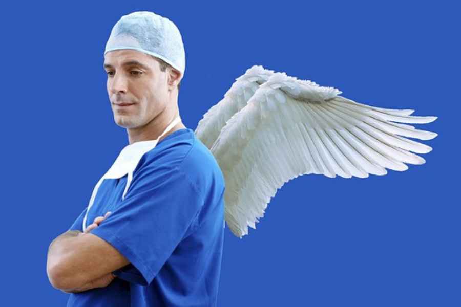 man in scrubs with wings