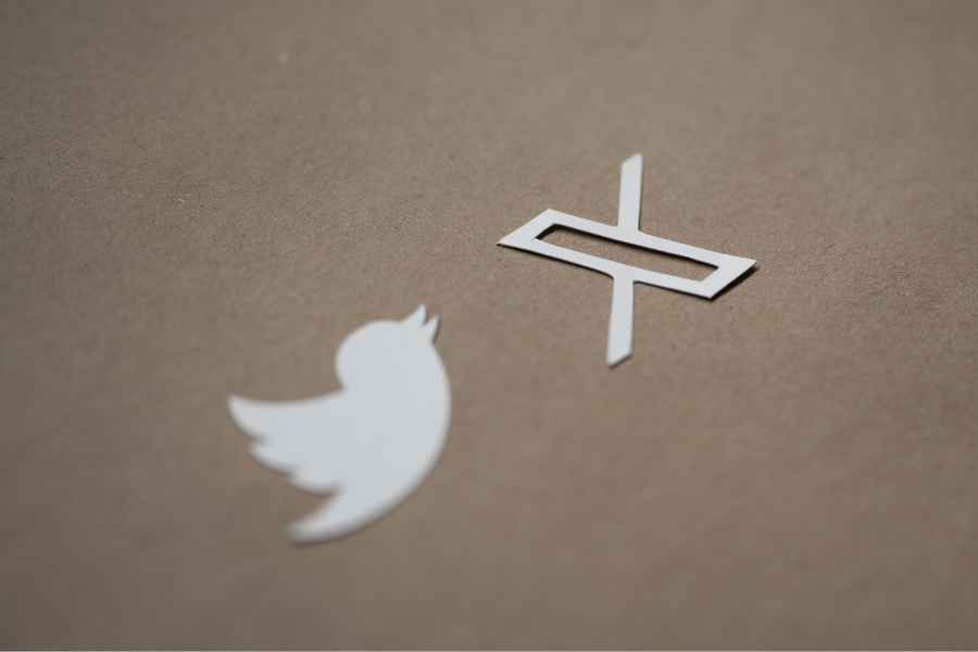 Twitter and X logos on brown background