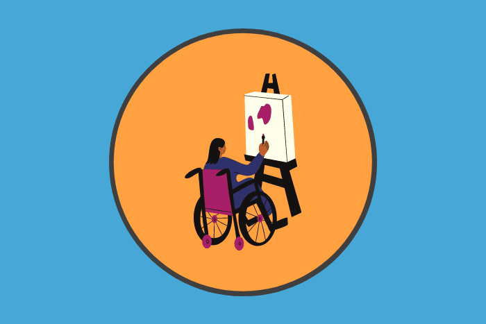 A girl in a wheelchair painting